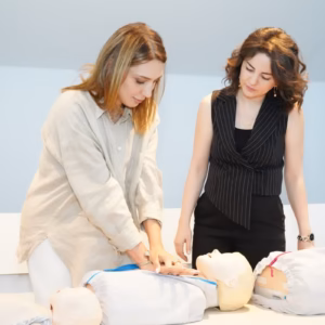 learners practising CPR on training manikins