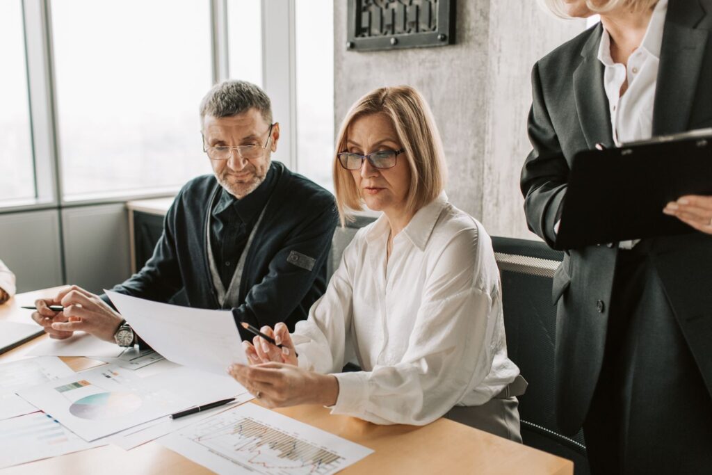 professionals reviewing documents during a consultancy discussion